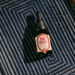 Dad Grass CBD Tincture Classic Formula 30 ML Bottle With 1200 MG Of CBD On A Carpet