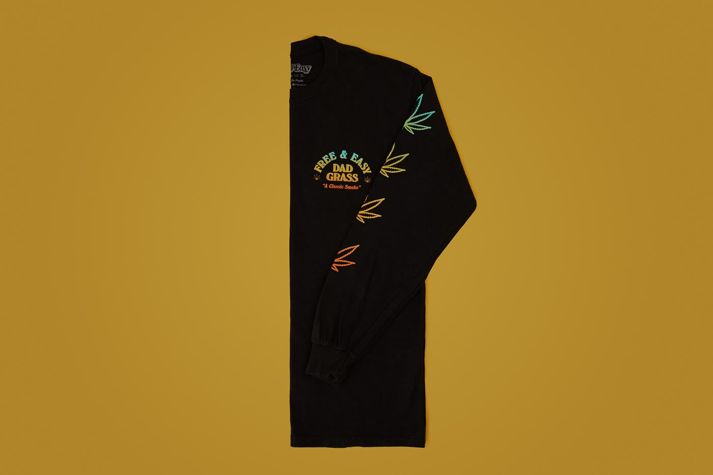 Unisex Black LS Tee With Dad Grass x Free & Easy And Hemp Leaves Printed On It Folded