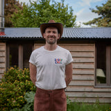 Man Wearing Dad Grass "Daddy Chill" Pride Tshirt - Front View